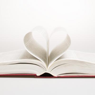 Book with pages curled into a heart shape