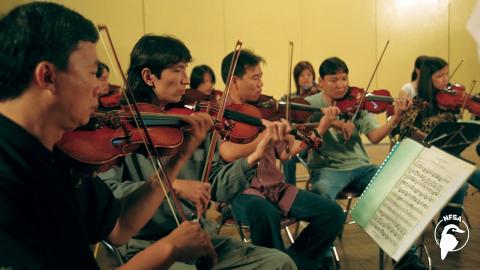 Screenshot of musicians from the film Vietnam Symphony